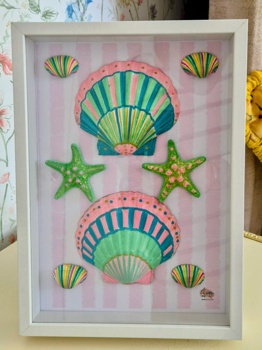 Framed artwork with colorful seashells and starfish on a striped background